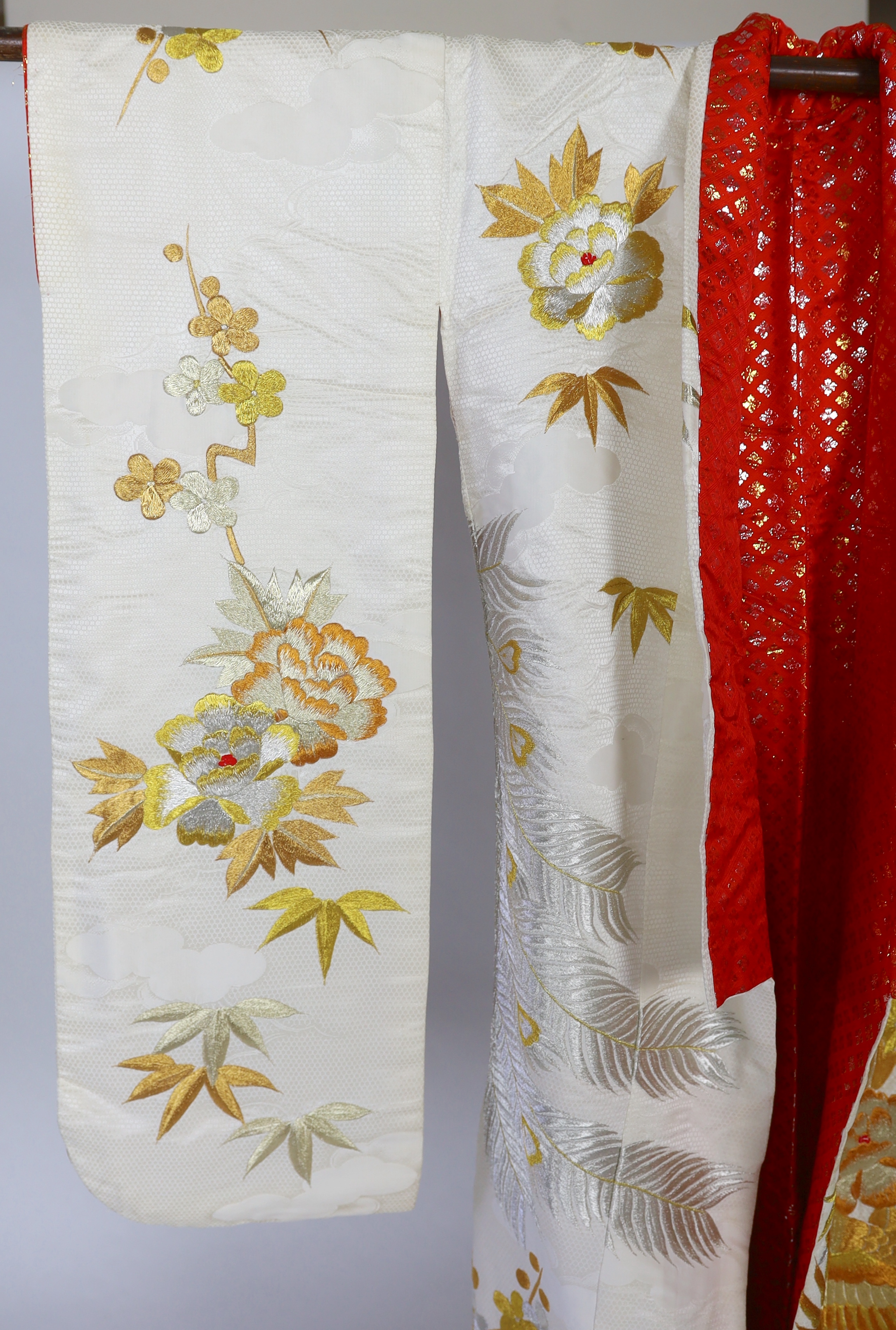 A 1960s-70s vintage Japanese embroidered wedding kimono, embroidered with pewter, bronze, silver and gold coloured metallic threads, into a large decorative design of peacocks with fanned tail feathers and trailing flowe